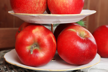 Tasty ripe apples on serving tray on table close up