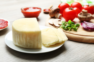 Ingredients for cooking pizza on wooden table, closeup