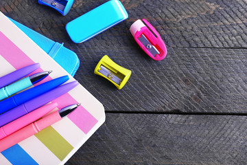 Colorful stationery on wooden table, closeup