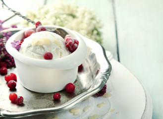 Beautiful composition with tasty ice cream and lilac flowers