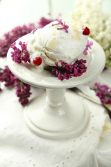 Beautiful composition with tasty ice cream and lilac flowers
