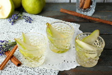 Pear juice with fresh fruits on table close up
