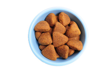 Blue ceramic dogs bowls. Dry dog food in bowl isolated on white background. Dry dog food isolated on white background