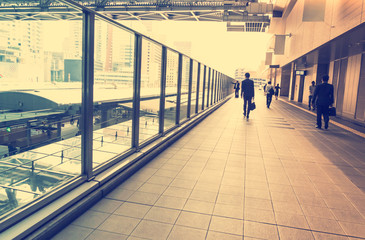 Business men walking inside a train station