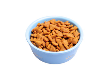 Blue ceramic dogs bowls. Dry dog food in bowl isolated on white background. Dry dog food isolated on white background