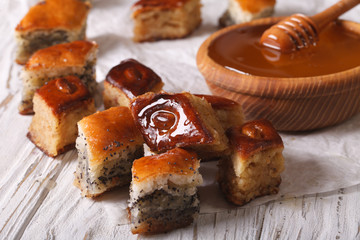 Baklava Honey with poppy seeds and nuts close-up. horizontal
