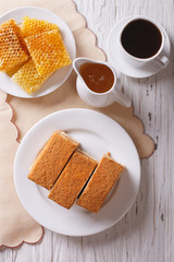 honey cake, coffee, and honeycomb. vertical top view
