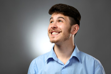 Portrait of smiling man on gray background
