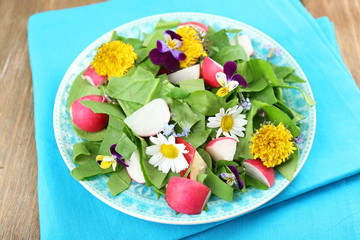 Light organic salad with flowers, close up