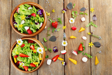 Light organic salad with flowers, close up