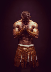 Rome warrior praying on the black background