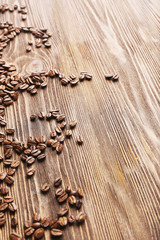 Obraz na płótnie Canvas Coffee beans on wooden background