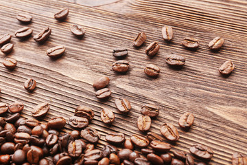 Coffee beans on wooden background