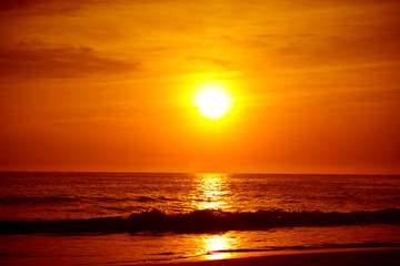Fototapeta na wymiar Sandy beach at golden sunset