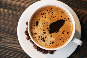 Cup of coffee on table close up