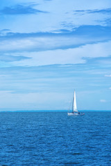 Obraz premium Boat Sailing at Blue Sea