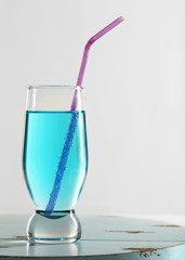 Glass of water on table on light background