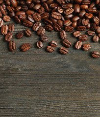 Coffee beans on wooden background
