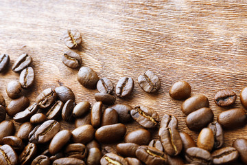 Coffee beans on wooden background