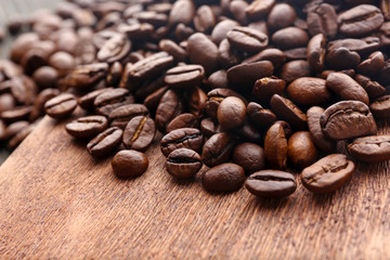 Coffee beans on wooden background