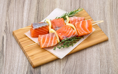 Raw salmon skewers