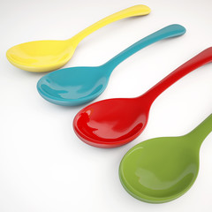 Colorful spoon on white background