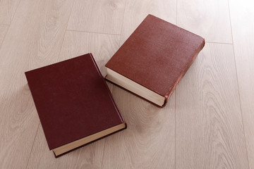 Old books on wooden background