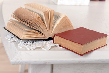 Heap of old books on table close up