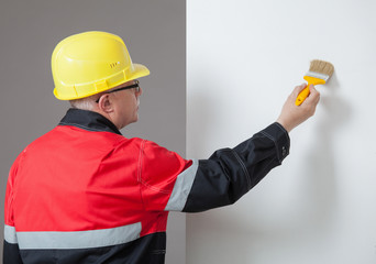 Painter painting a wall