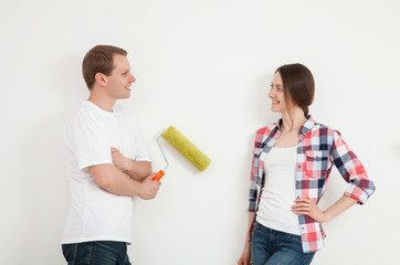 Young couple discussing a renovation of a home