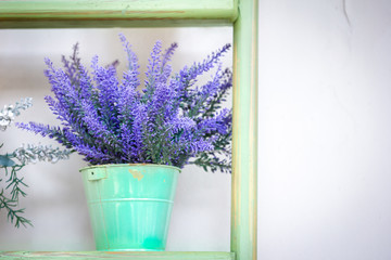 lavender in the pot on a wooden stand