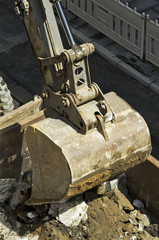 bulldozer excavator machine industry picks up debris on city str