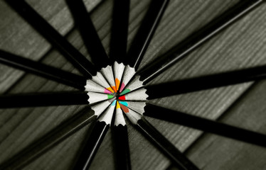 Black and white image of colored pencils with isolated pencil ag