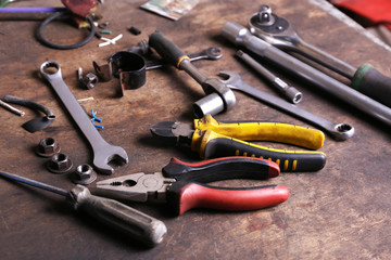 Different tools on workplace in garage