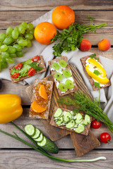 Still life with vegetarian sandwiches on wooden table