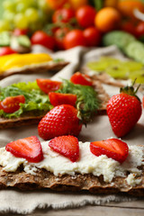 Still life with vegetarian sandwiches on wooden table
