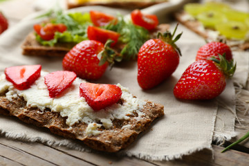 Still life with vegetarian sandwiches on wooden table