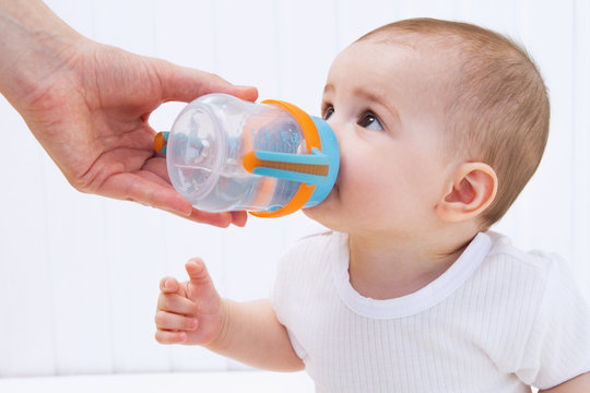 Beautiful Baby Drinking Water From Bottle