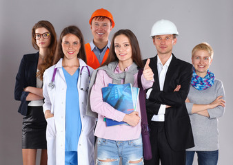 Portrait of smiling people with various occupations and showing