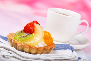One fruit cake and teacup