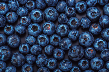 Wet blueberries on black slate