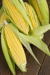corn cob on wooden background