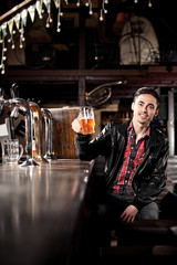 Man drinking beer in pub