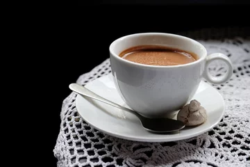 Zelfklevend Fotobehang Hot chocolate in mug, on table, on dark background © Africa Studio