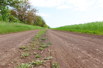 Country road over blue sky background