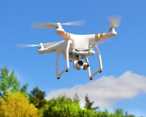 Drone quadrocopter with high resolution digital camera. New tool for aerial photo and video. 