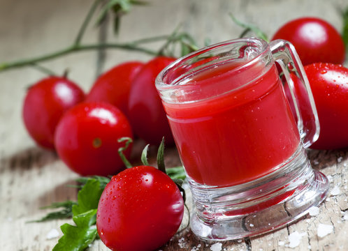 Tomato juice in old-fashioned mug, selective focus