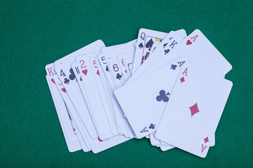 Playing Cards On Green Background