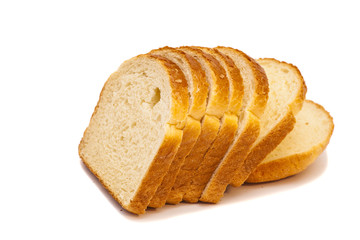The cut loaf of bread isolated on white