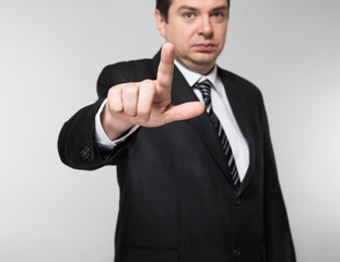 Businessman points finger